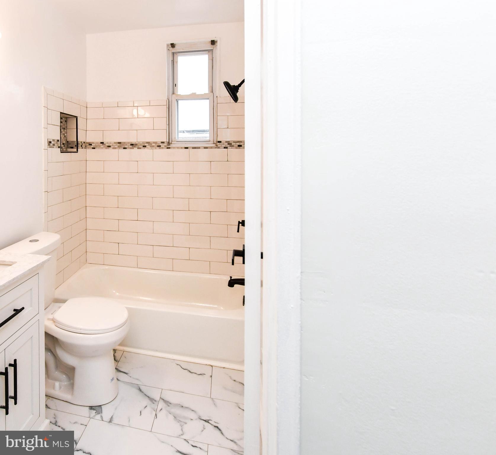 4227 Nash Street Southeast Washington, DC 20020 - Photo 16 of 50 a bathroom with a toilet and a bathtub