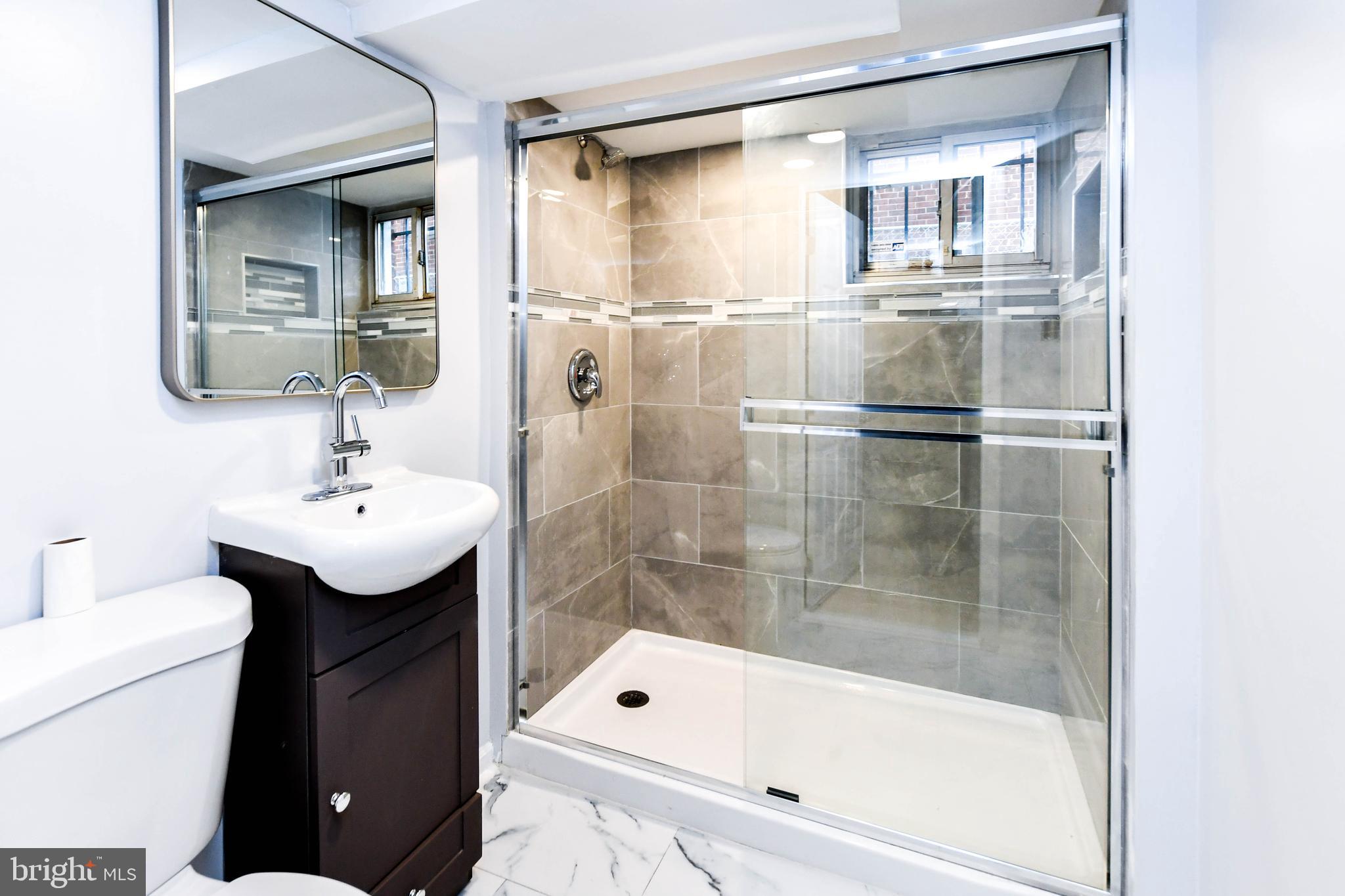 4227 Nash Street Southeast Washington, DC 20020 - Photo 21 of 50 a bathroom with a bathtub shower sink vanity and toilet