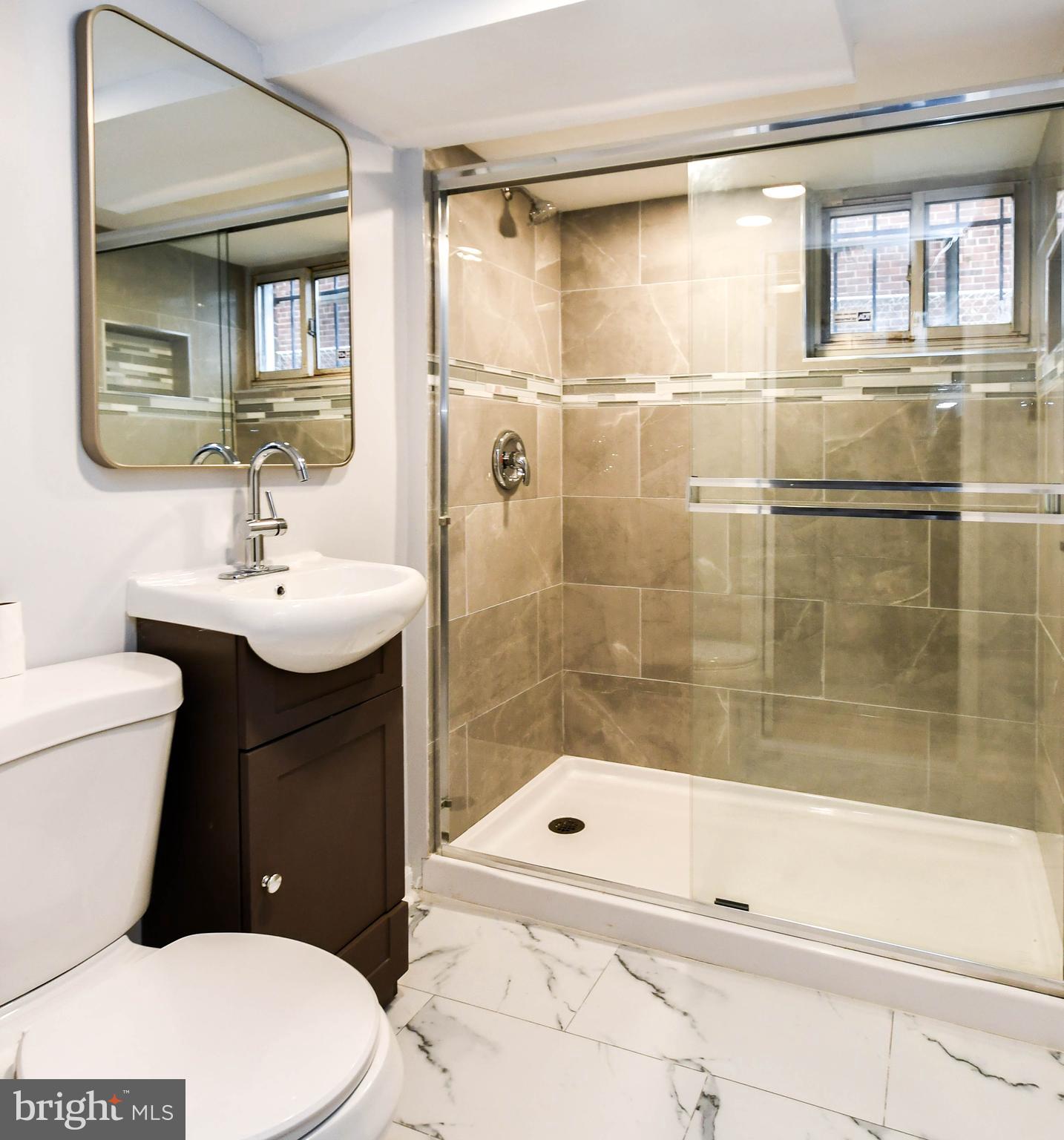 4227 Nash Street Southeast Washington, DC 20020 - Photo 22 of 50 a bathroom with a sink a toilet and shower