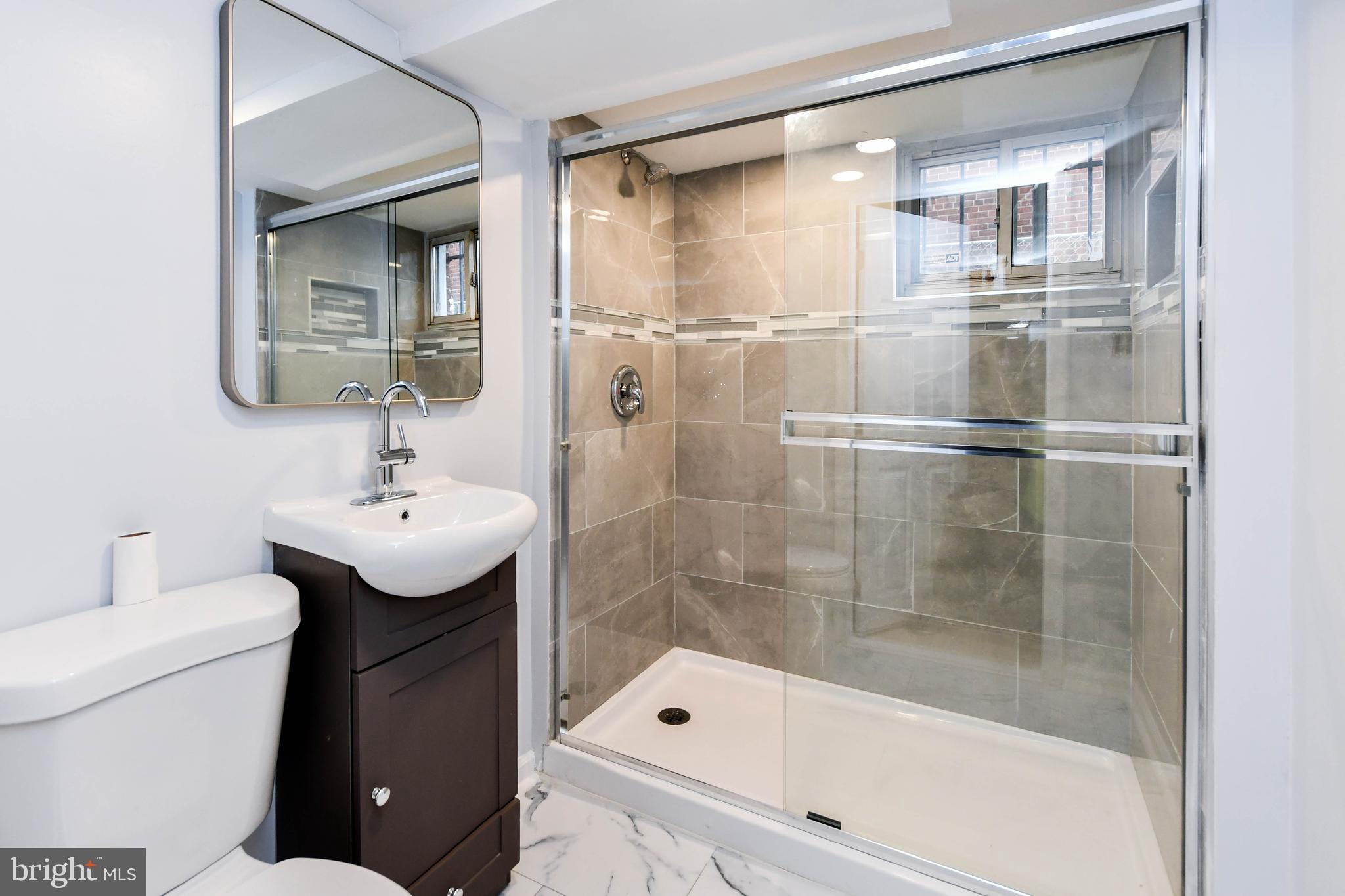 4227 Nash Street Southeast Washington, DC 20020 - Photo 25 of 50 a bathroom with a sink toilet and shower