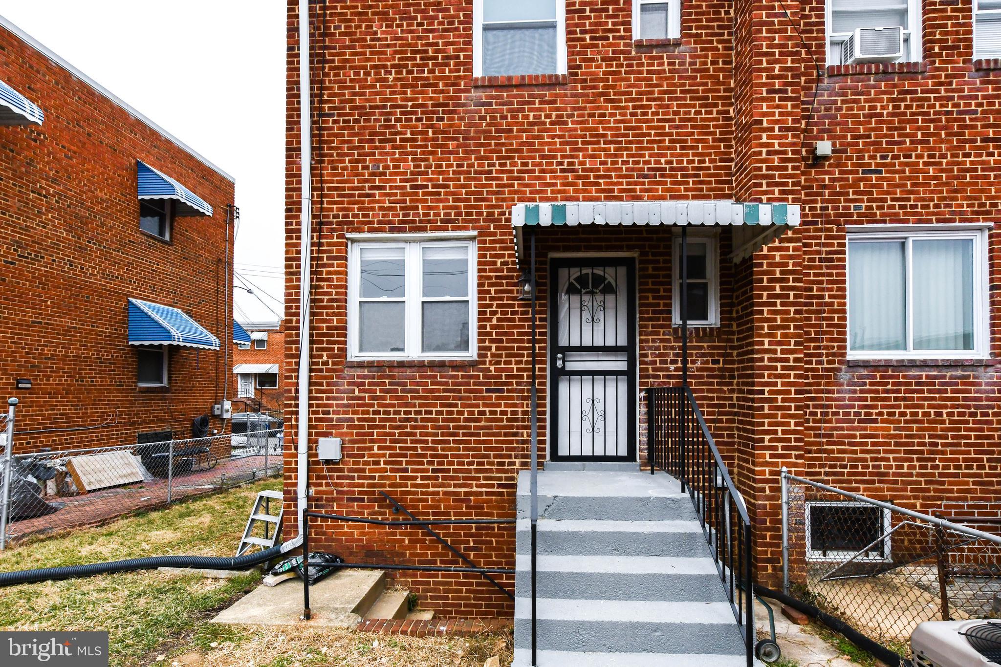4227 Nash Street Southeast Washington, DC 20020 - Photo 8 of 50 a front view of a house with a yard