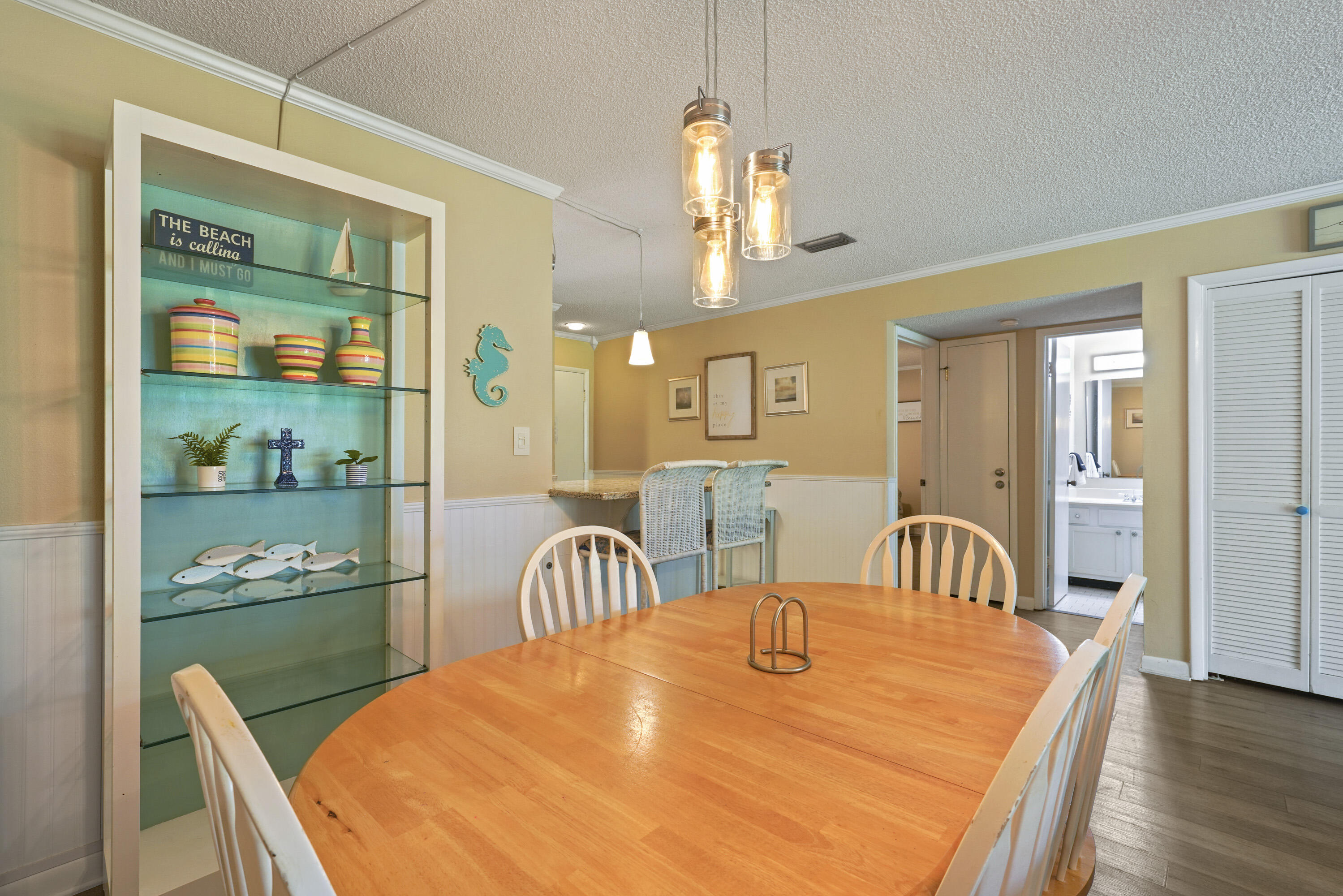 3755 Scenic Highway 98, Unit 1601 Destin, FL 32541 - Photo 13 of 50 a dining room with furniture and wooden floor