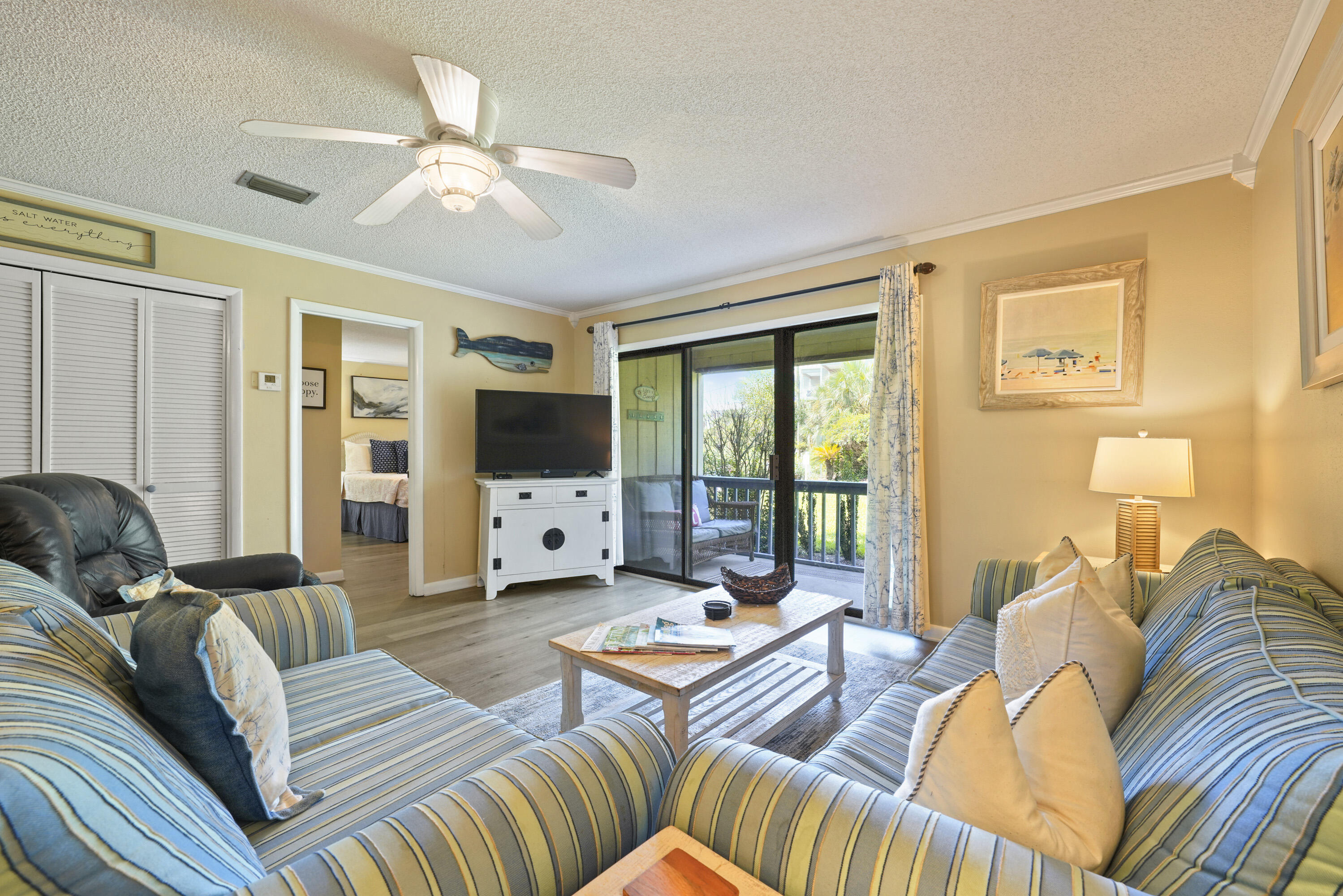 3755 Scenic Highway 98, Unit 1601 Destin, FL 32541 - Photo 14 of 50 a living room with furniture fireplace and flat screen tv
