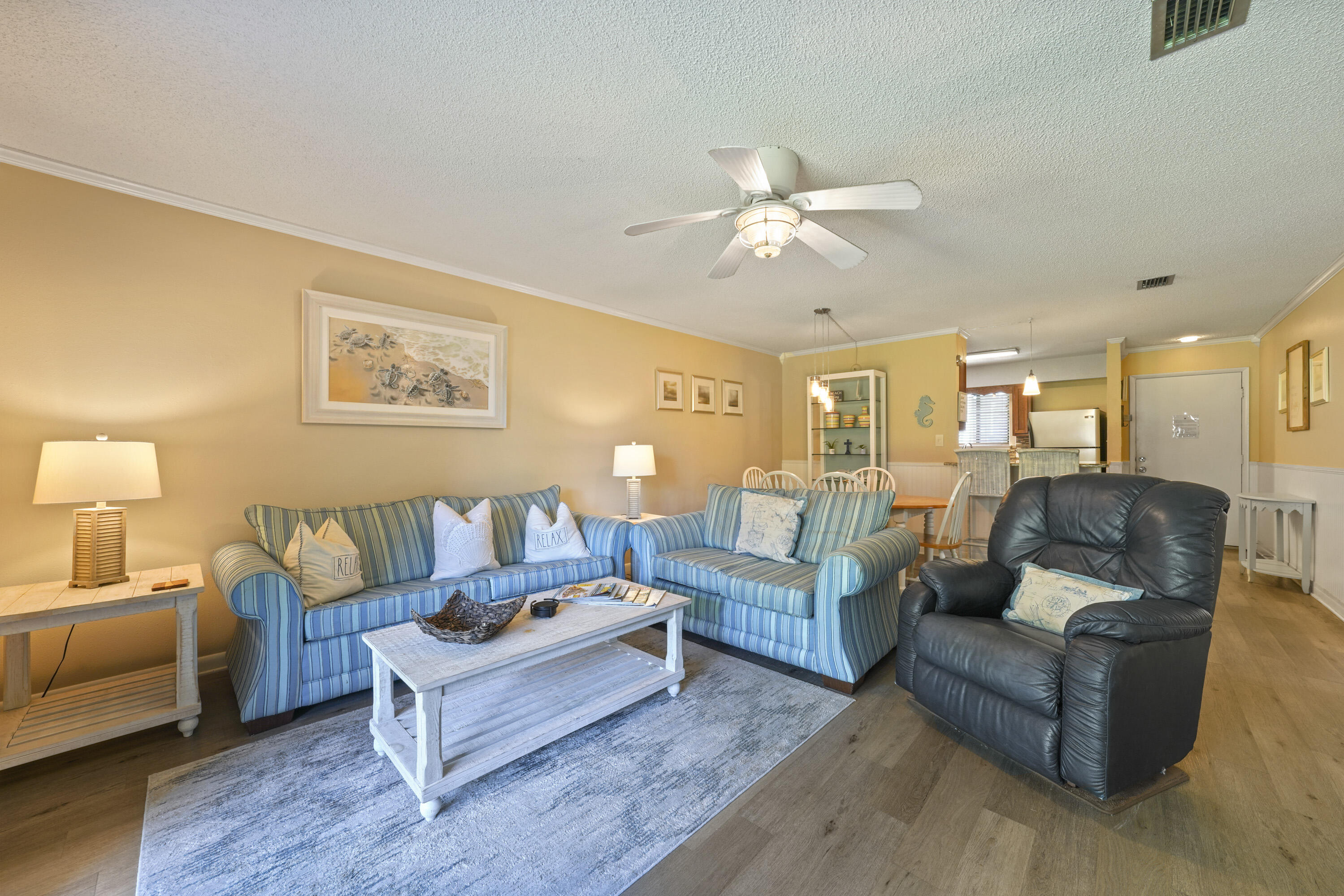 3755 Scenic Highway 98, Unit 1601 Destin, FL 32541 - Photo 16 of 50 a living room with furniture and wooden floor