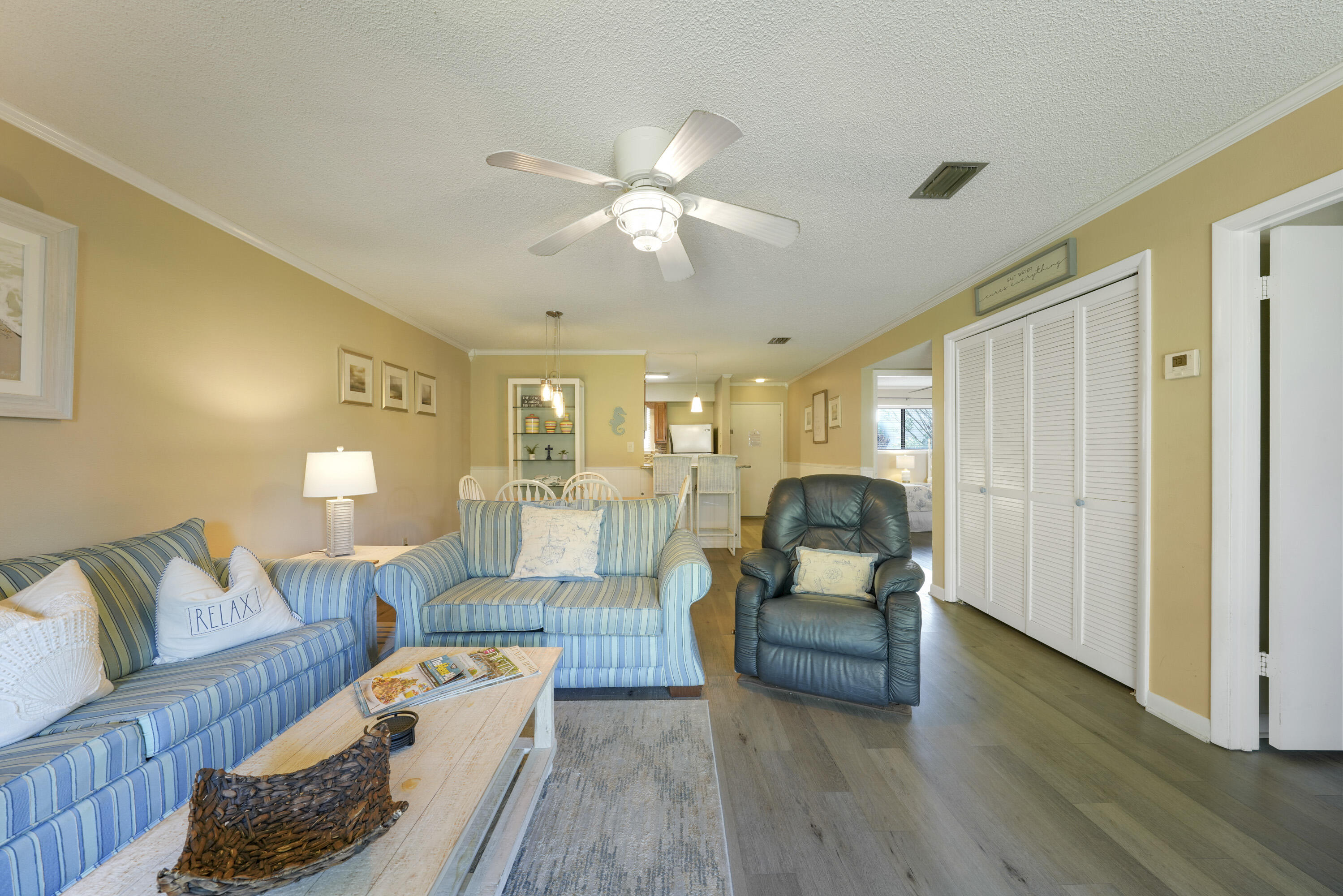 3755 Scenic Highway 98, Unit 1601 Destin, FL 32541 - Photo 17 of 50 a living room with furniture and wooden floor