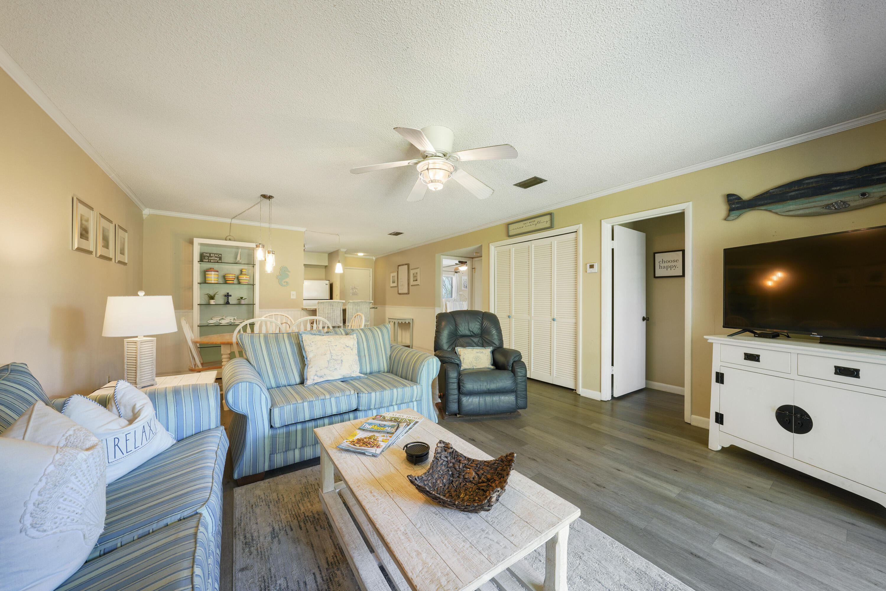 3755 Scenic Highway 98, Unit 1601 Destin, FL 32541 - Photo 18 of 50 a living room with furniture and a flat screen tv