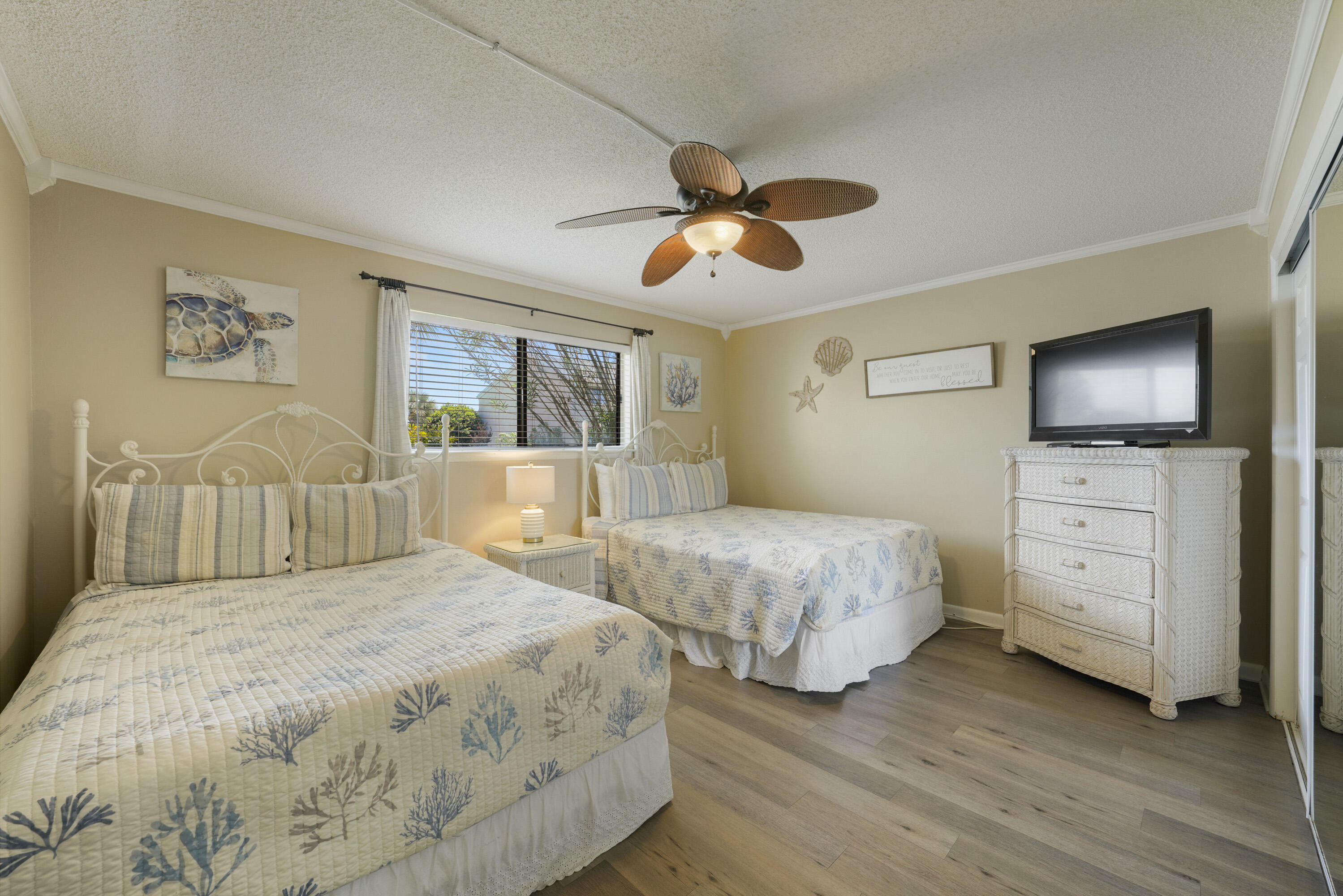3755 Scenic Highway 98, Unit 1601 Destin, FL 32541 - Photo 19 of 50 a bedroom with a bed and wooden floor