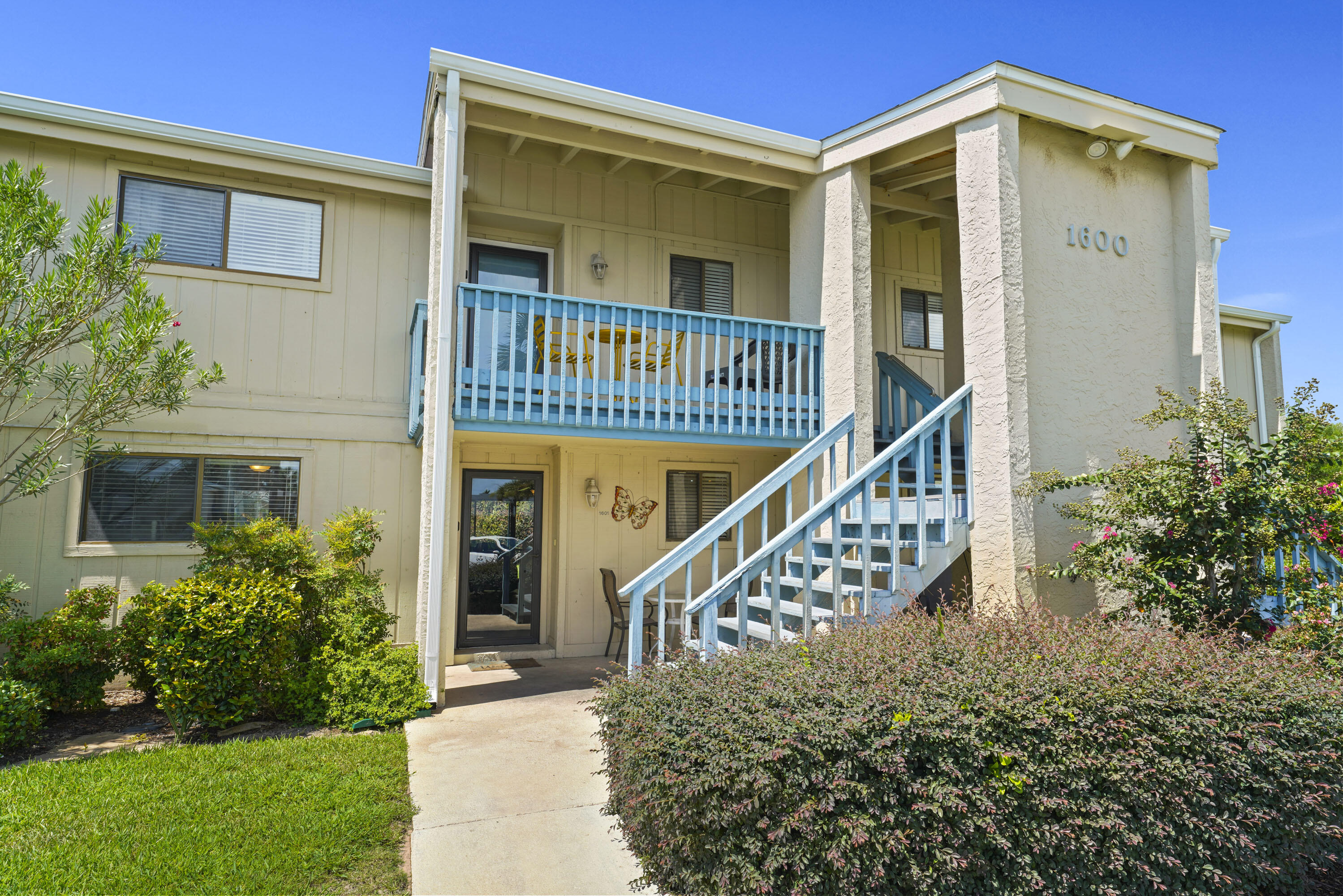 3755 Scenic Highway 98, Unit 1601 Destin, FL 32541 - Photo 2 of 50 front view of a house with a small yard