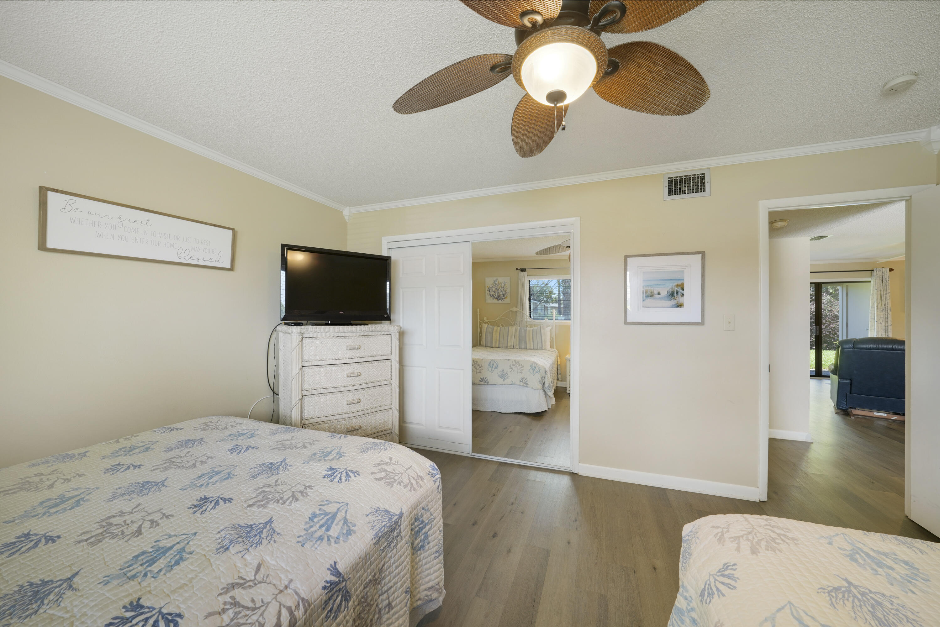 3755 Scenic Highway 98, Unit 1601 Destin, FL 32541 - Photo 21 of 50 a bedroom with a bed and a flat screen tv