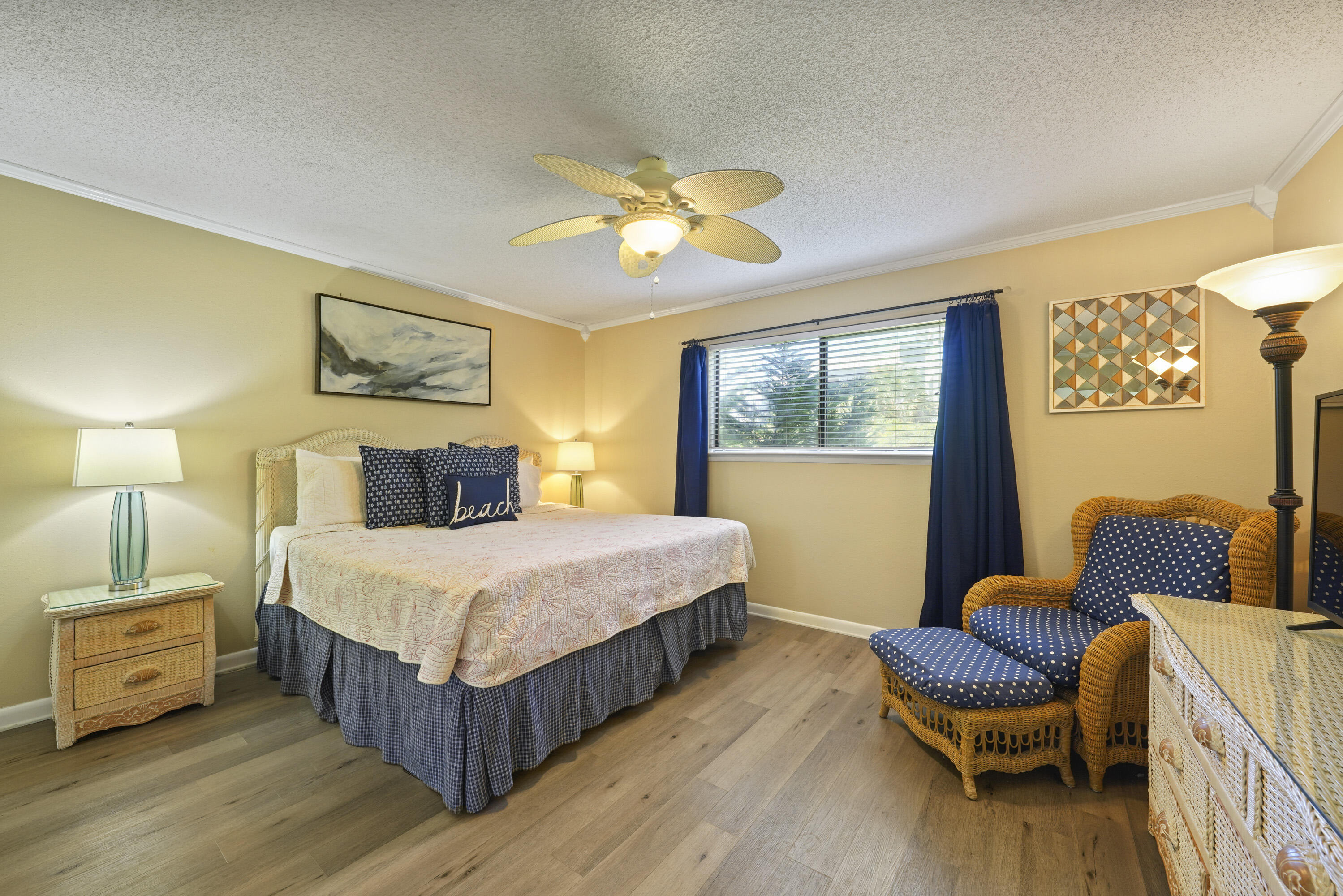3755 Scenic Highway 98, Unit 1601 Destin, FL 32541 - Photo 23 of 50 a bedroom with a bed and a chair