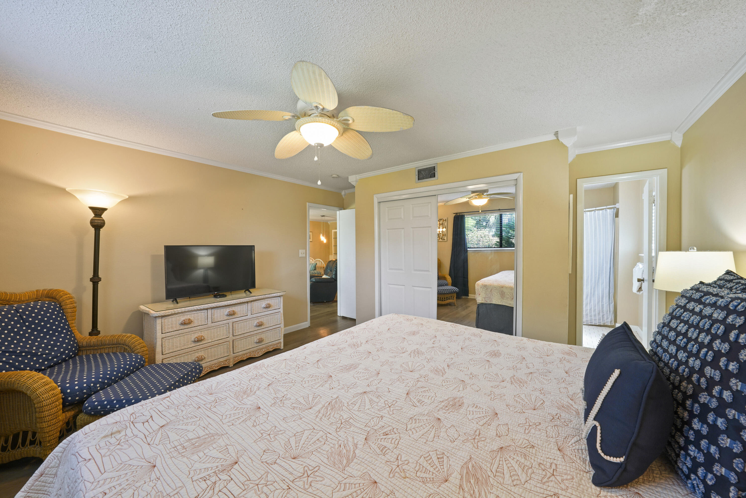 3755 Scenic Highway 98, Unit 1601 Destin, FL 32541 - Photo 25 of 50 a bedroom with furniture and a flat screen tv