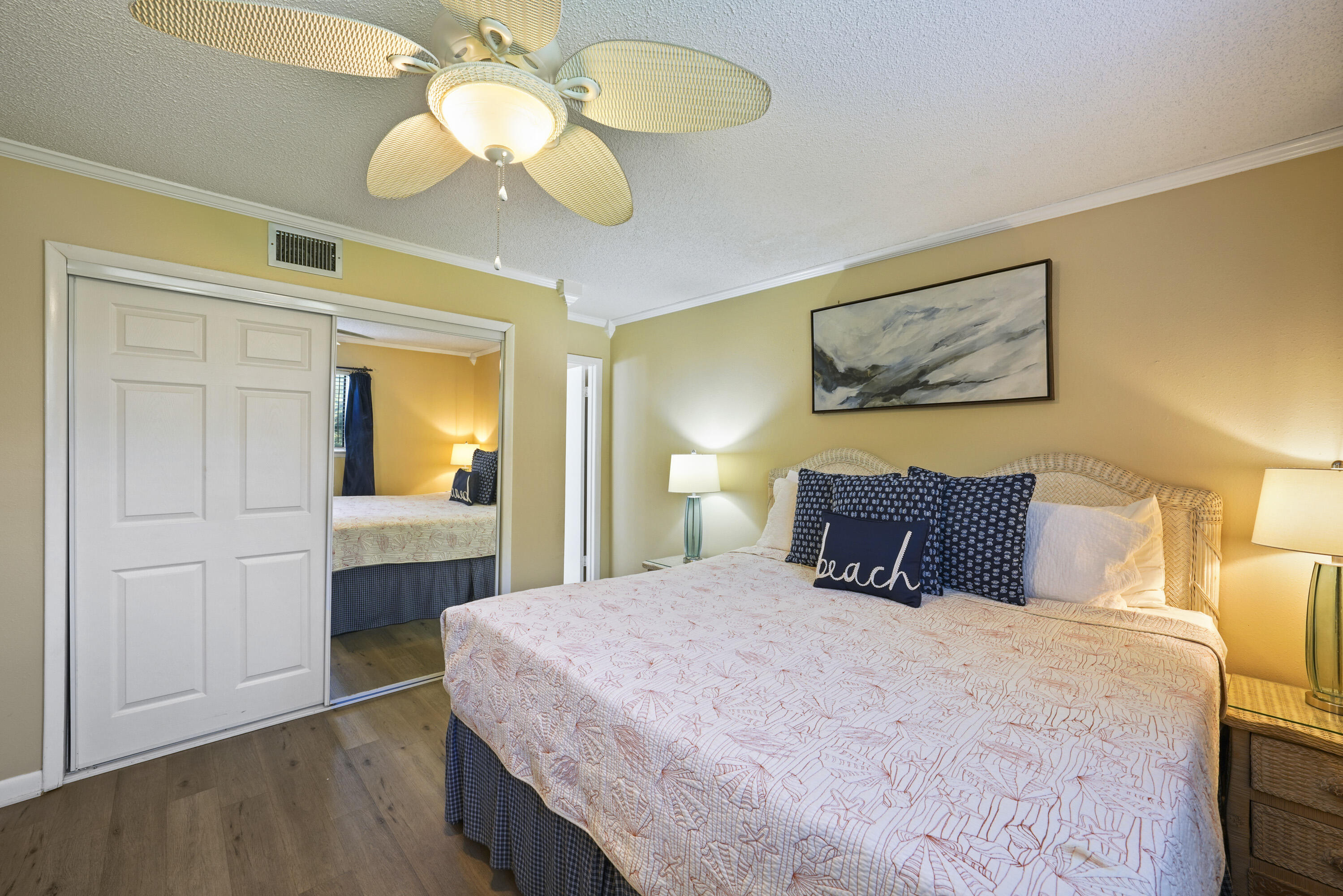 3755 Scenic Highway 98, Unit 1601 Destin, FL 32541 - Photo 26 of 50 a bedroom with a bed and a chandelier