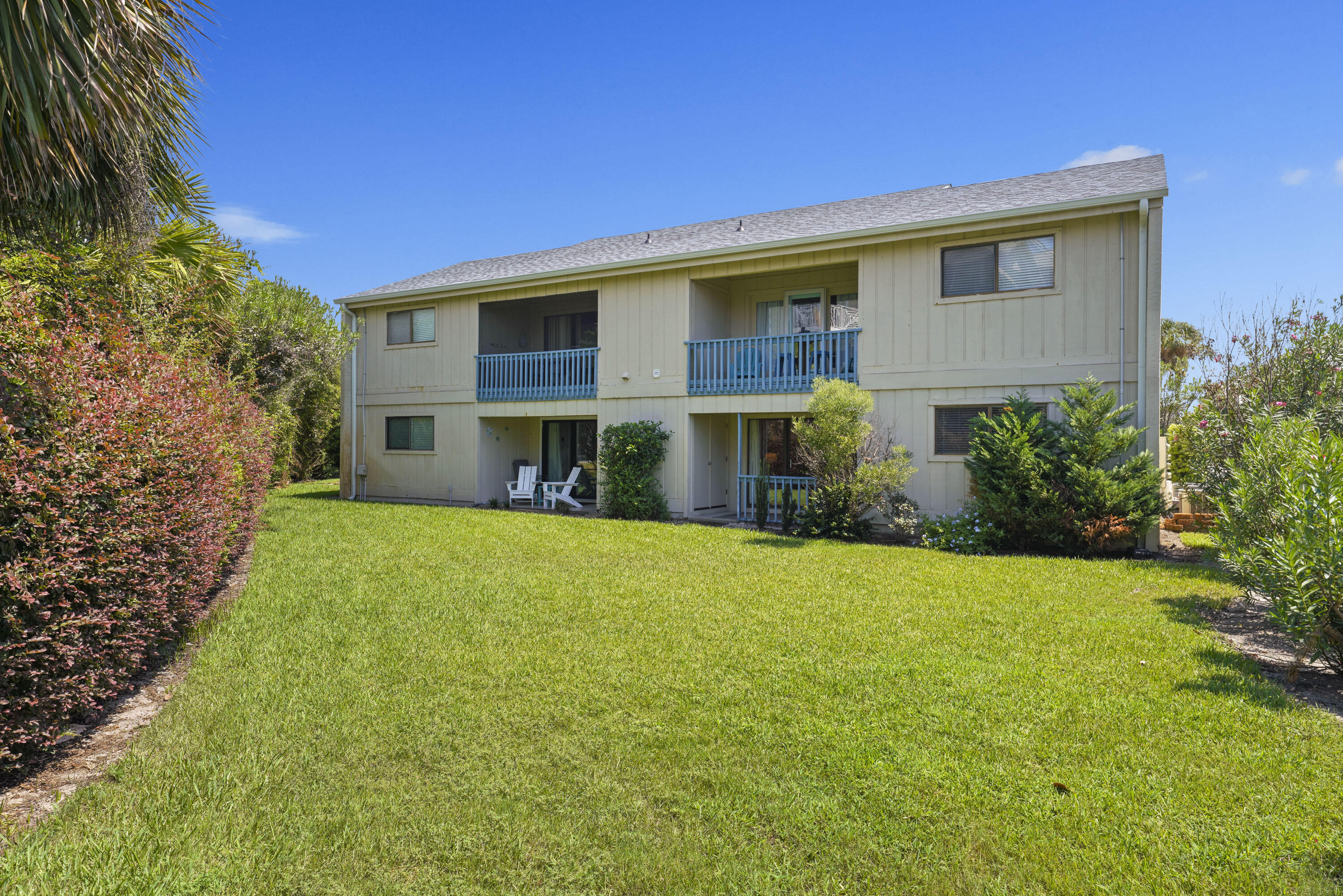 3755 Scenic Highway 98, Unit 1601 Destin, FL 32541 - Photo 30 of 50 a view of an house with backyard and a tree