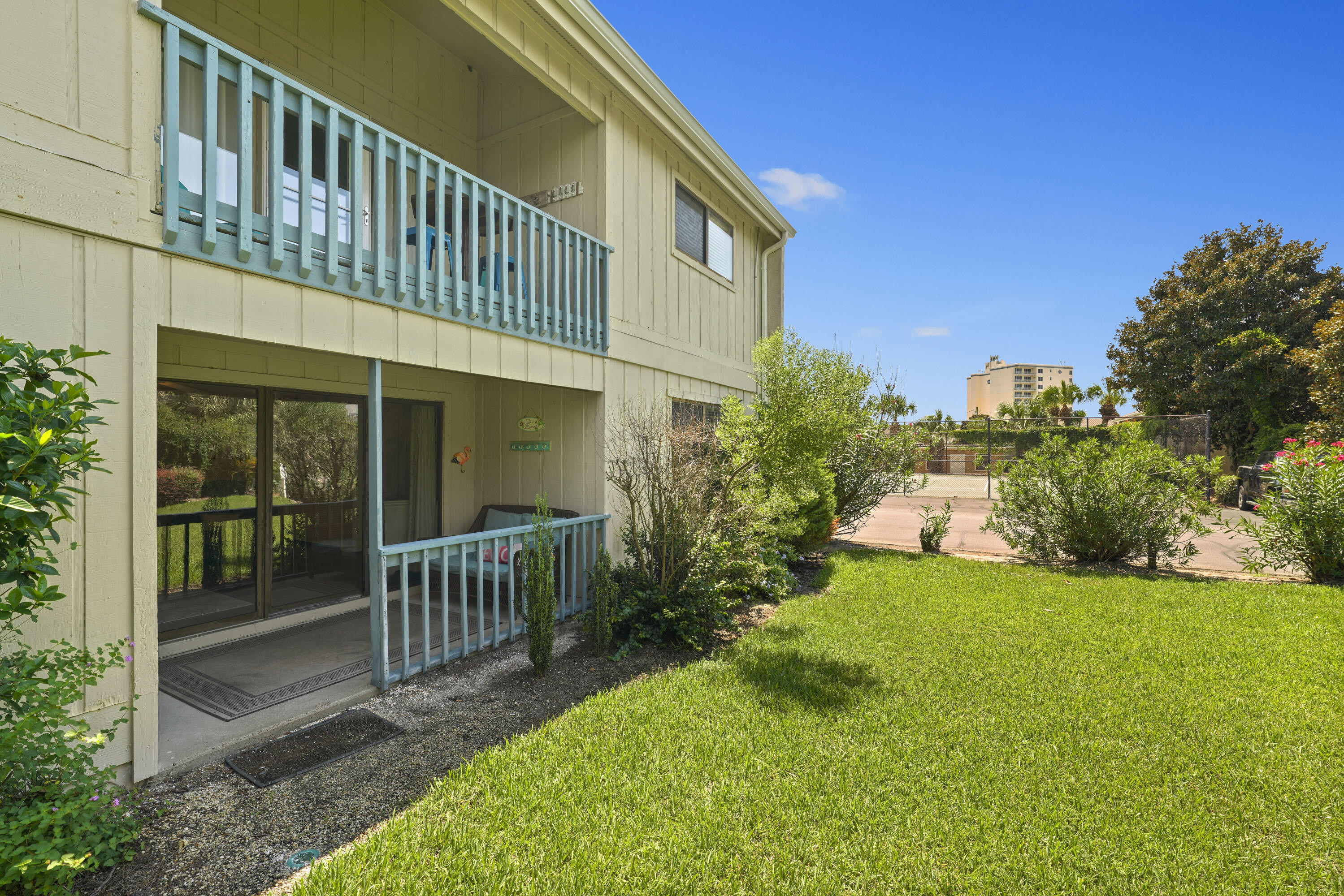 3755 Scenic Highway 98, Unit 1601 Destin, FL 32541 - Photo 32 of 50 a front view of a house with a garden