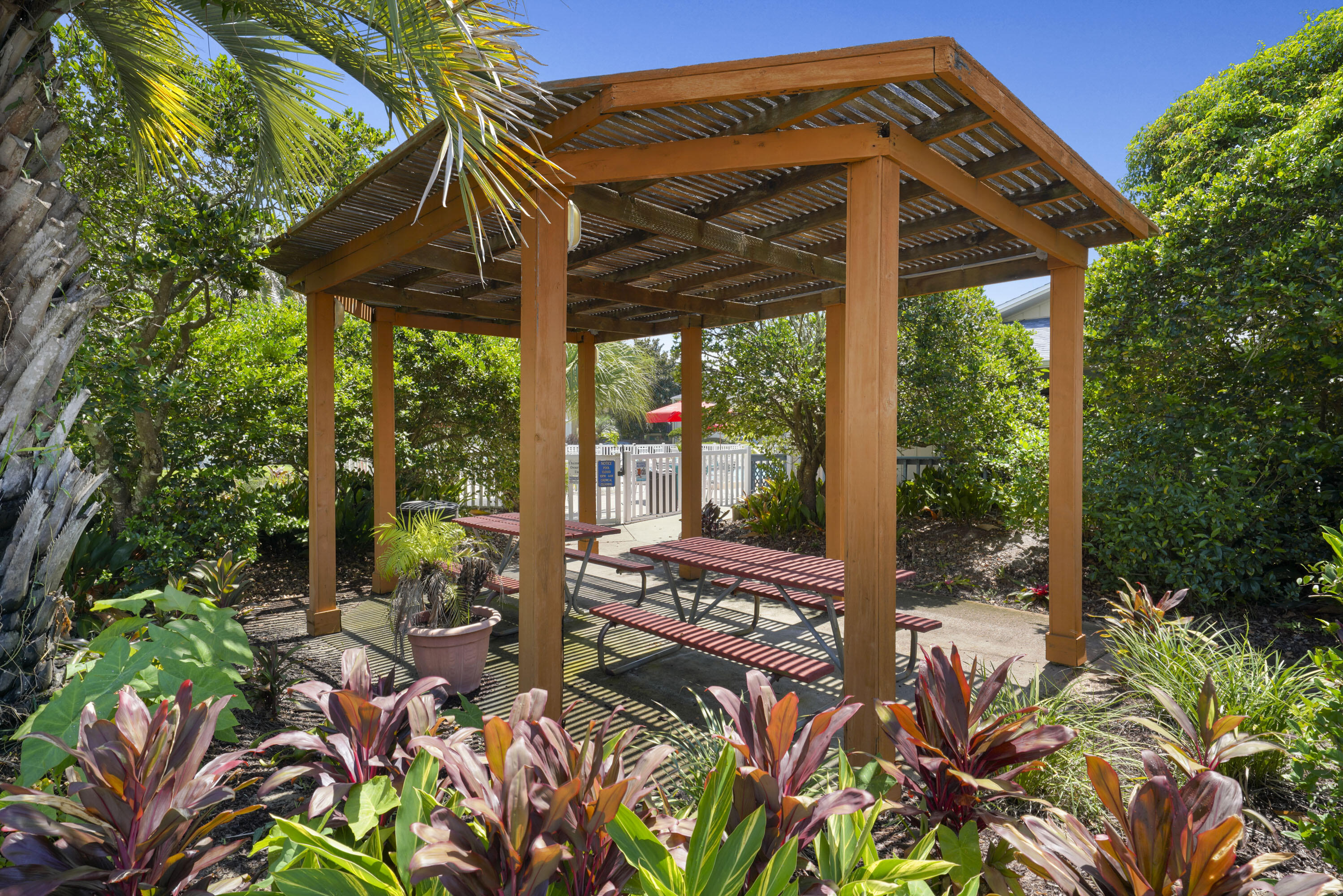 3755 Scenic Highway 98, Unit 1601 Destin, FL 32541 - Photo 36 of 50 a view of a patio with table and chairs under an umbrella