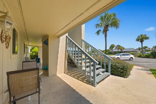 a view of balcony with furniture