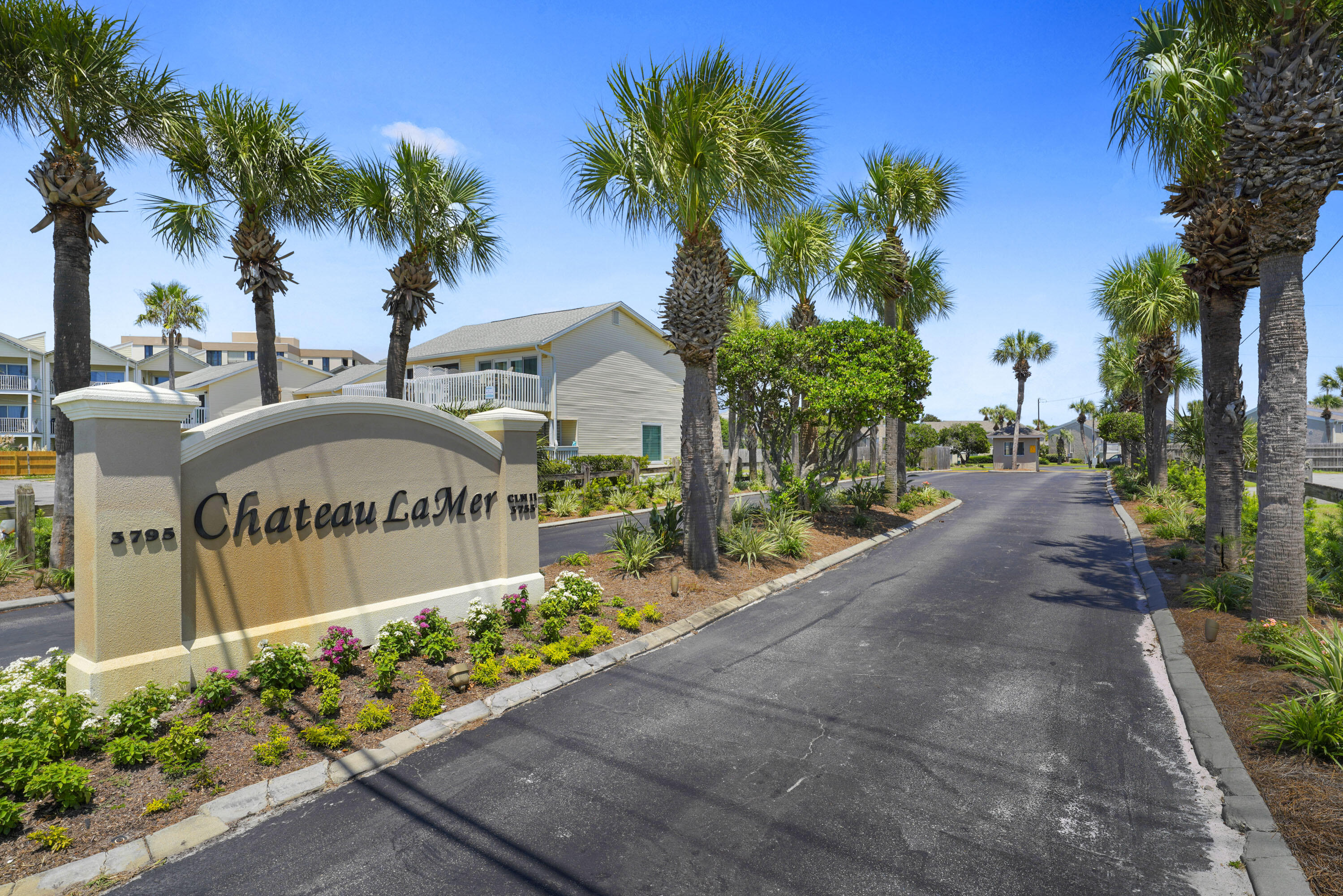 3755 Scenic Highway 98, Unit 1601 Destin, FL 32541 - Photo 46 of 50 a front view of multi story residential apartment building with sign board and yard