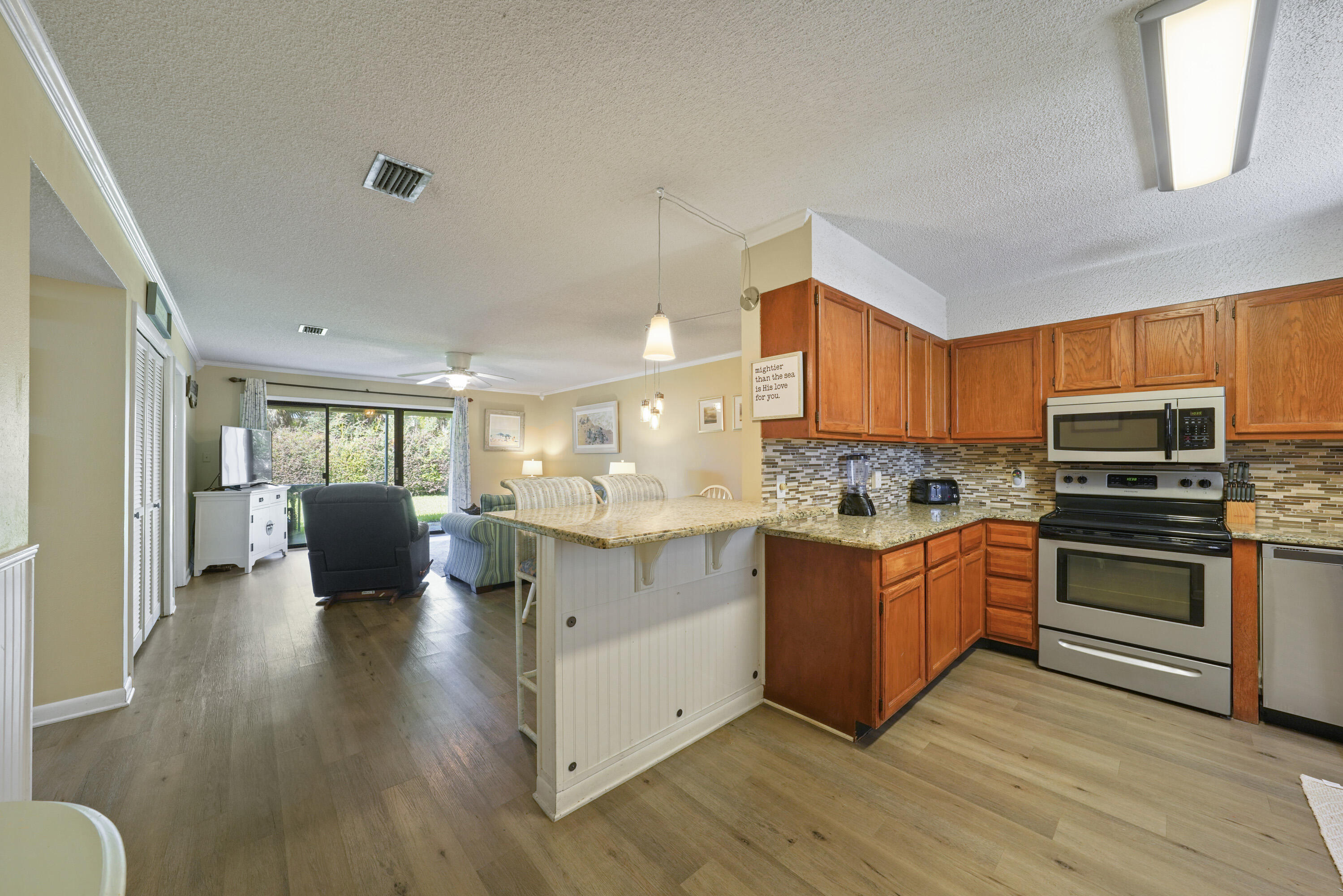 3755 Scenic Highway 98, Unit 1601 Destin, FL 32541 - Photo 5 of 50 a kitchen with stainless steel appliances a stove top oven a sink dishwasher and a refrigerator