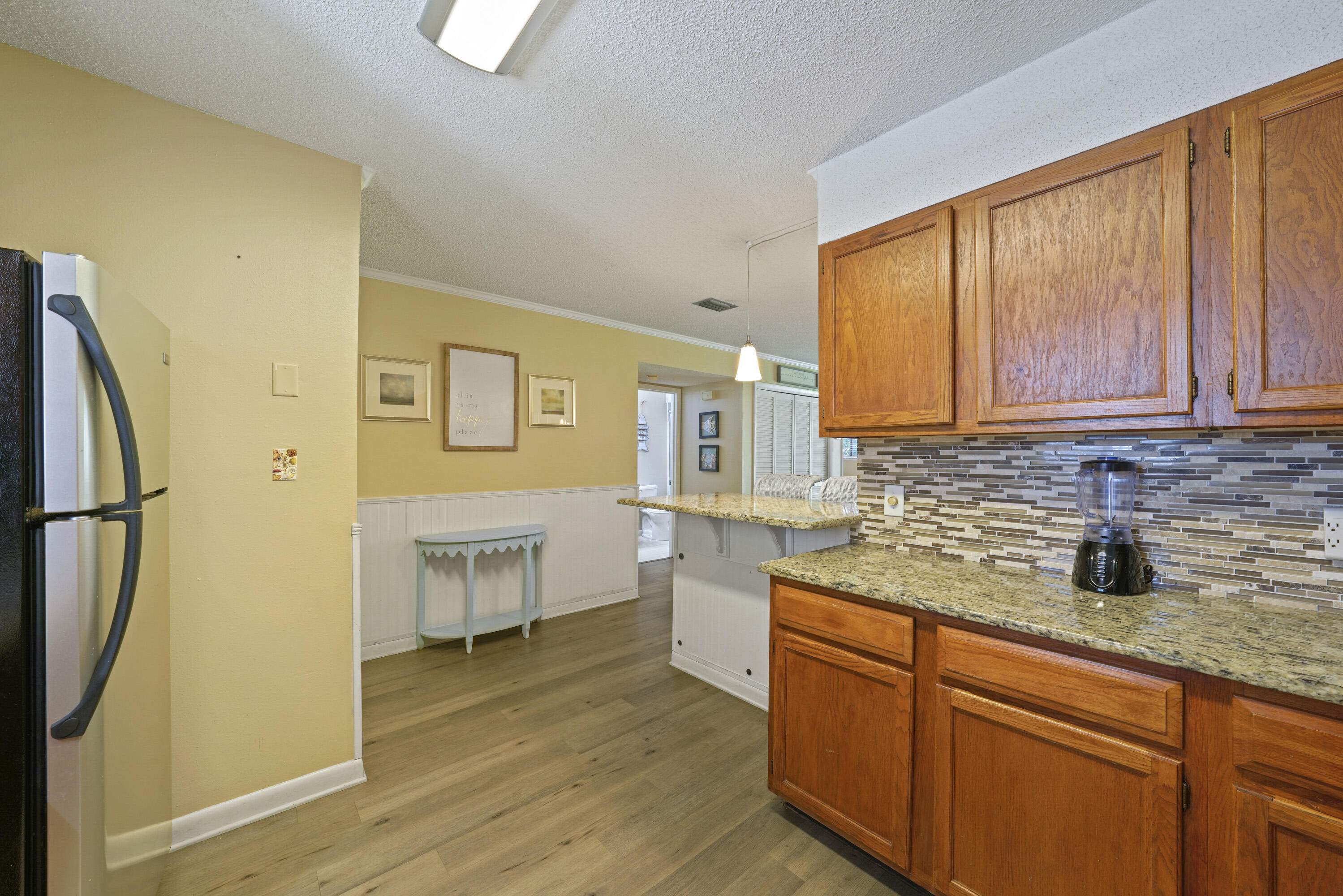 3755 Scenic Highway 98, Unit 1601 Destin, FL 32541 - Photo 8 of 50 a kitchen with stainless steel appliances granite countertop a refrigerator sink and cabinets