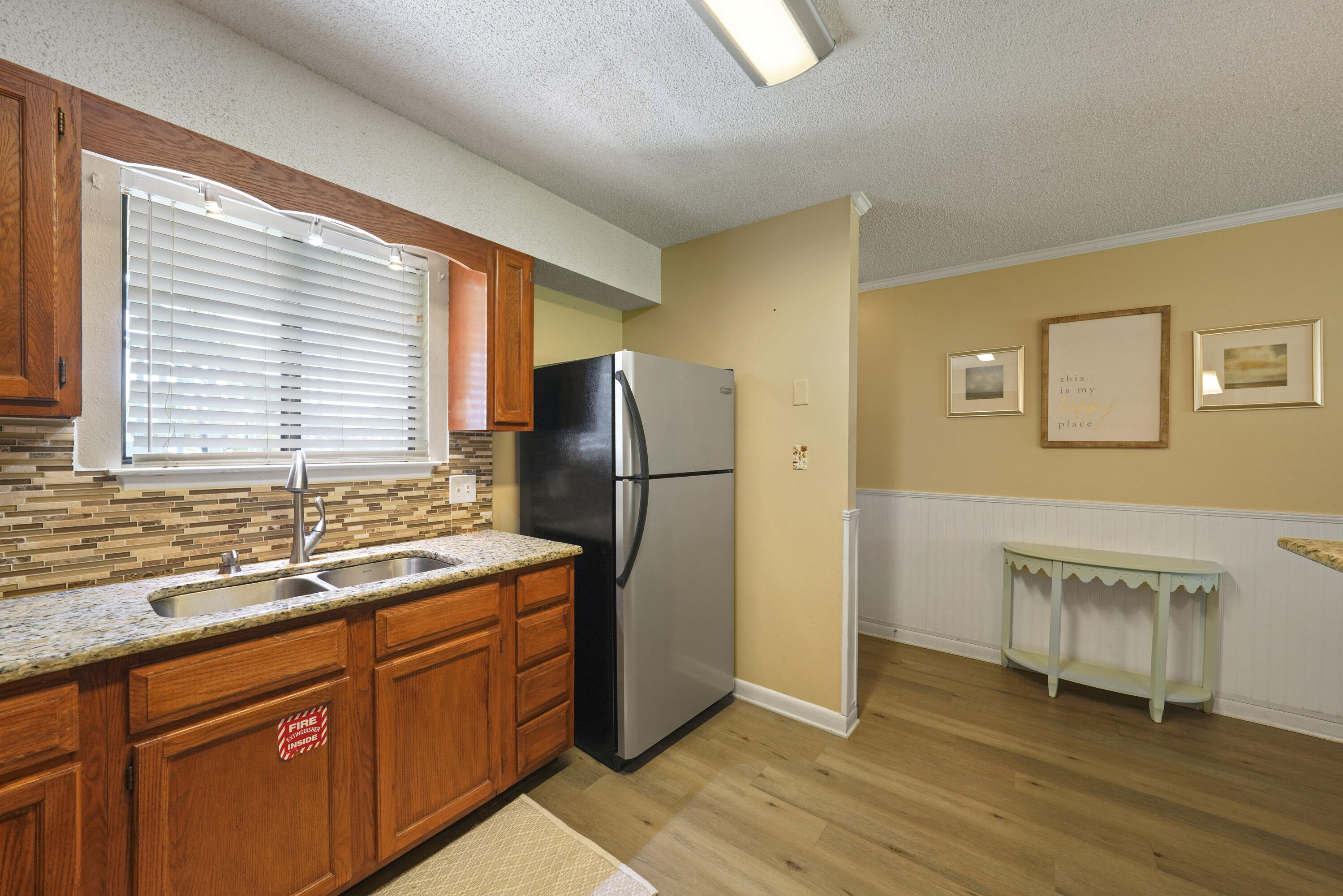 3755 Scenic Highway 98, Unit 1601 Destin, FL 32541 - Photo 9 of 50 a kitchen with stainless steel appliances granite countertop a refrigerator and a sink