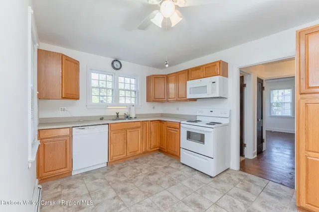 a kitchen with stainless steel appliances granite countertop a stove and a sink