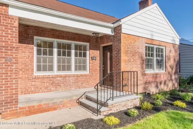 a front view of a house with a porch