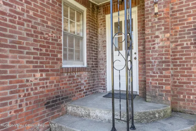 a front view of a building with a glass door
