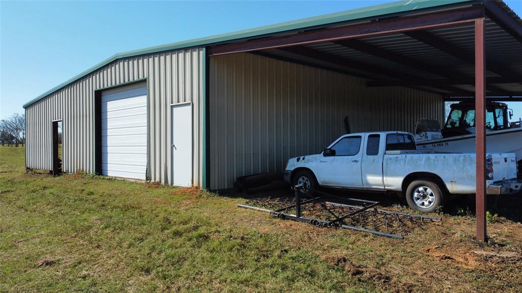 2162 County Road 174 Overton, TX 75684 - Photo 29 of 34 a front view of a house with a yard