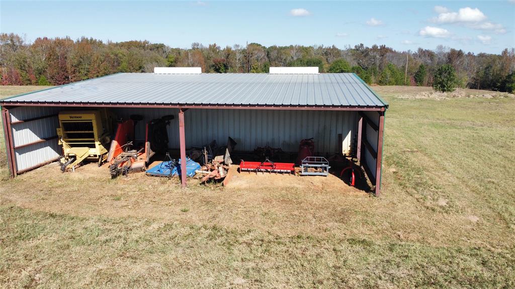 2162 County Road 174 Overton, TX 75684 - Photo 30 of 34 a view of a house with a patio and a slide