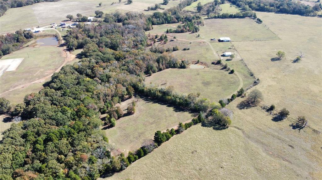 2162 County Road 174 Overton, TX 75684 - Photo 5 of 34 an aerial view of a house with a yard