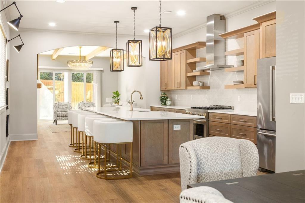 a kitchen with a refrigerator and a sink