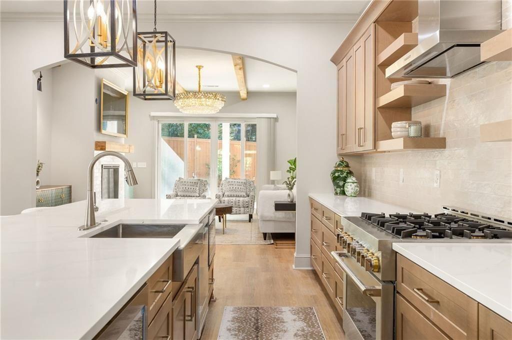 722 Lakeview Avenue Northeast, Unit A Atlanta, GA 30308 - Photo 12 of 48 a kitchen with a sink stove and cabinets