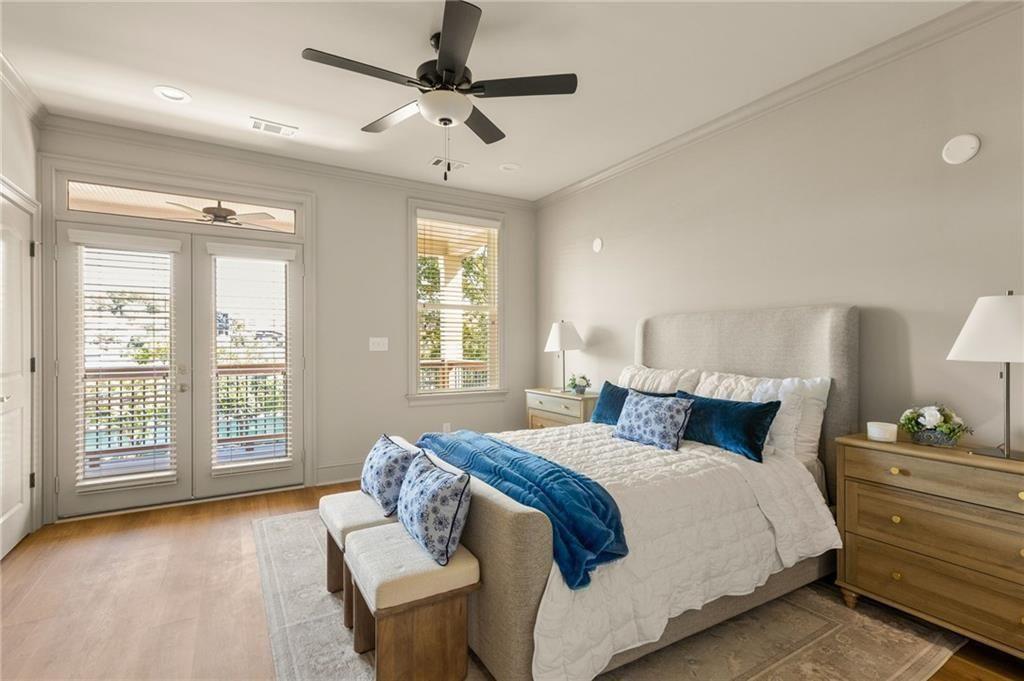 722 Lakeview Avenue Northeast, Unit A Atlanta, GA 30308 - Photo 22 of 48 a bedroom with a large bed and a large window