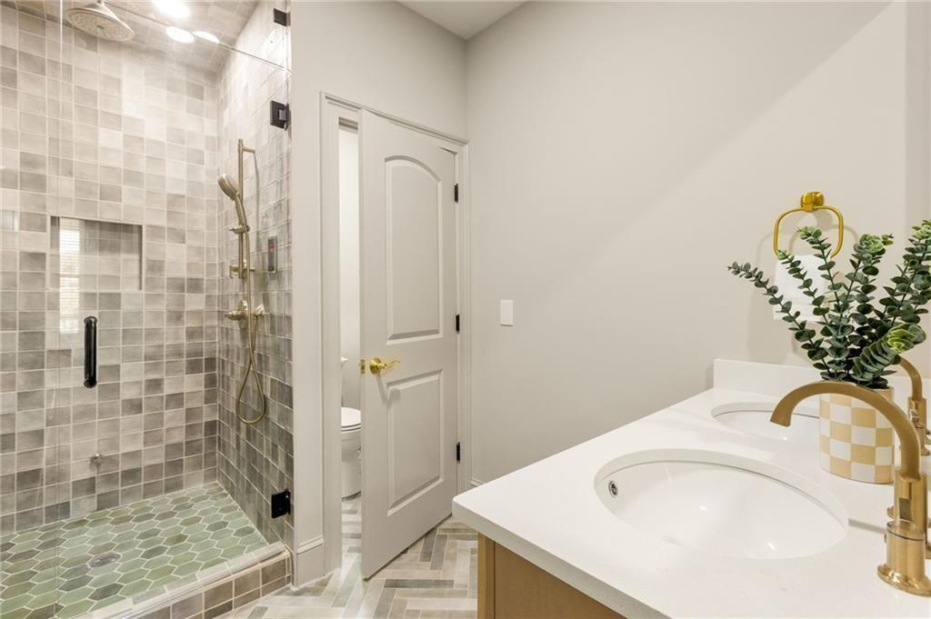 722 Lakeview Avenue Northeast, Unit A Atlanta, GA 30308 - Photo 24 of 48 a bathroom with a sink and a shower
