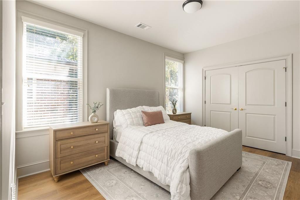 722 Lakeview Avenue Northeast, Unit A Atlanta, GA 30308 - Photo 28 of 48 a bedroom with a bed and a window