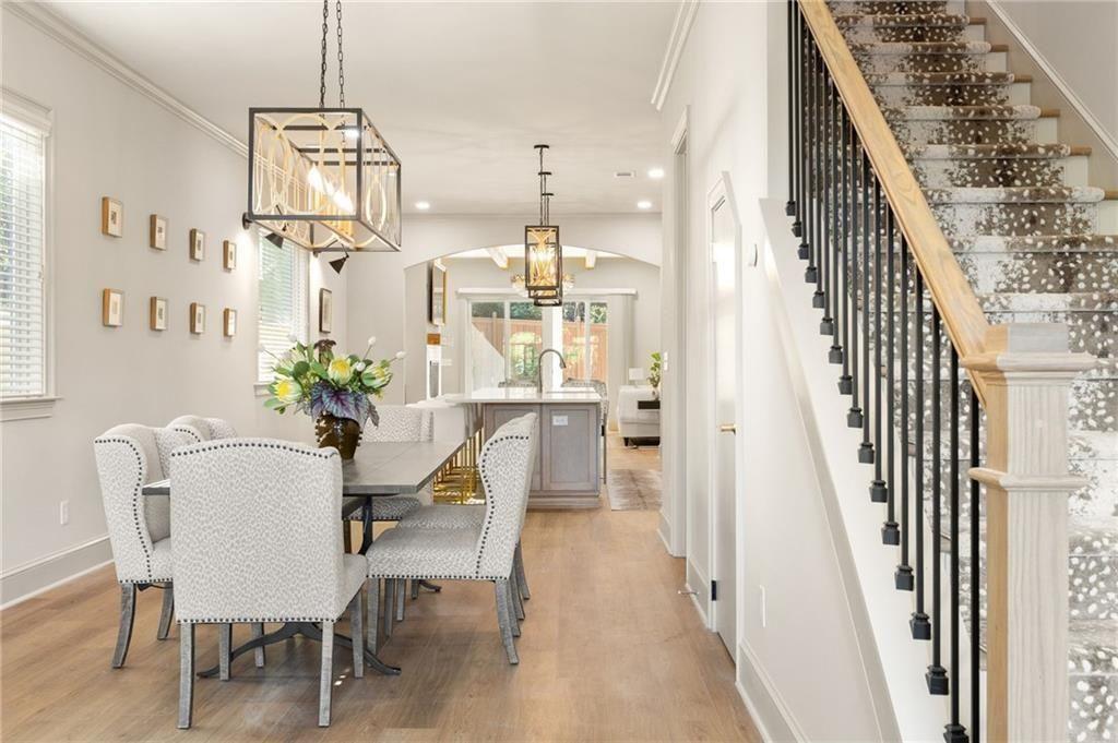 722 Lakeview Avenue Northeast, Unit A Atlanta, GA 30308 - Photo 3 of 48 a view of a dining room with furniture and wooden floor
