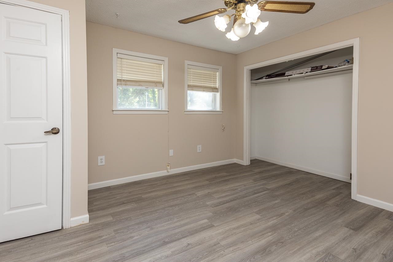 2718 Kate Bond Road Memphis, TN 38133 - Photo 26 of 39 wooden floor in an empty room with a window