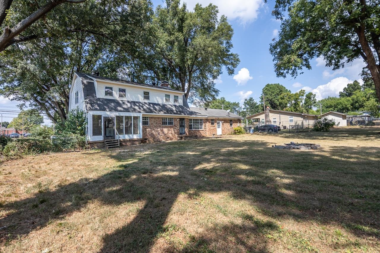 2718 Kate Bond Road Memphis, TN 38133 - Photo 30 of 39 a view of a house with a yard