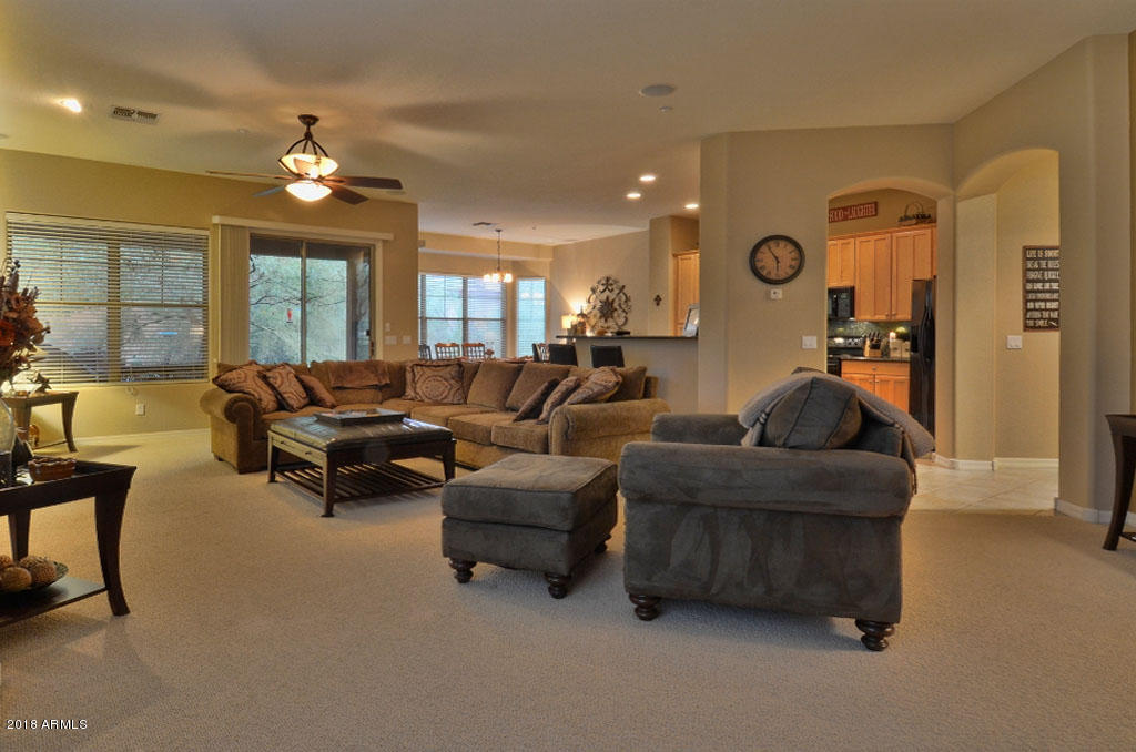 11475 East Helm Drive Scottsdale, AZ 85255 - Photo 13 of 35 a living room with furniture and a chandelier