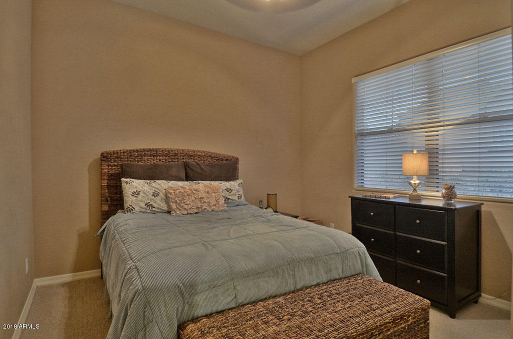 11475 East Helm Drive Scottsdale, AZ 85255 - Photo 16 of 35 a bedroom with a bed and a dresser