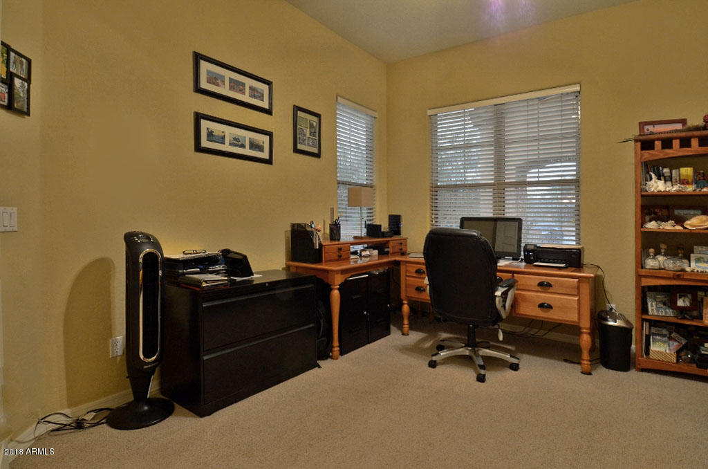 11475 East Helm Drive Scottsdale, AZ 85255 - Photo 18 of 35 a view of a workspace with furniture and a window