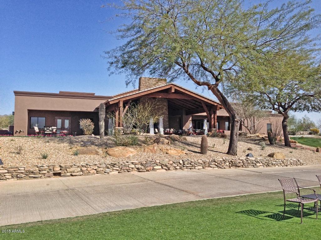 11475 East Helm Drive Scottsdale, AZ 85255 - Photo 26 of 35 a view of a house with a yard covered in snow