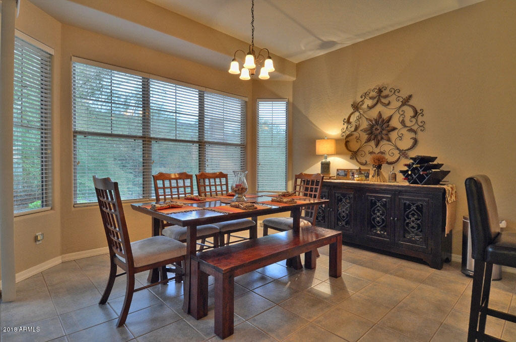 11475 East Helm Drive Scottsdale, AZ 85255 - Photo 9 of 35 a dining room with furniture and window