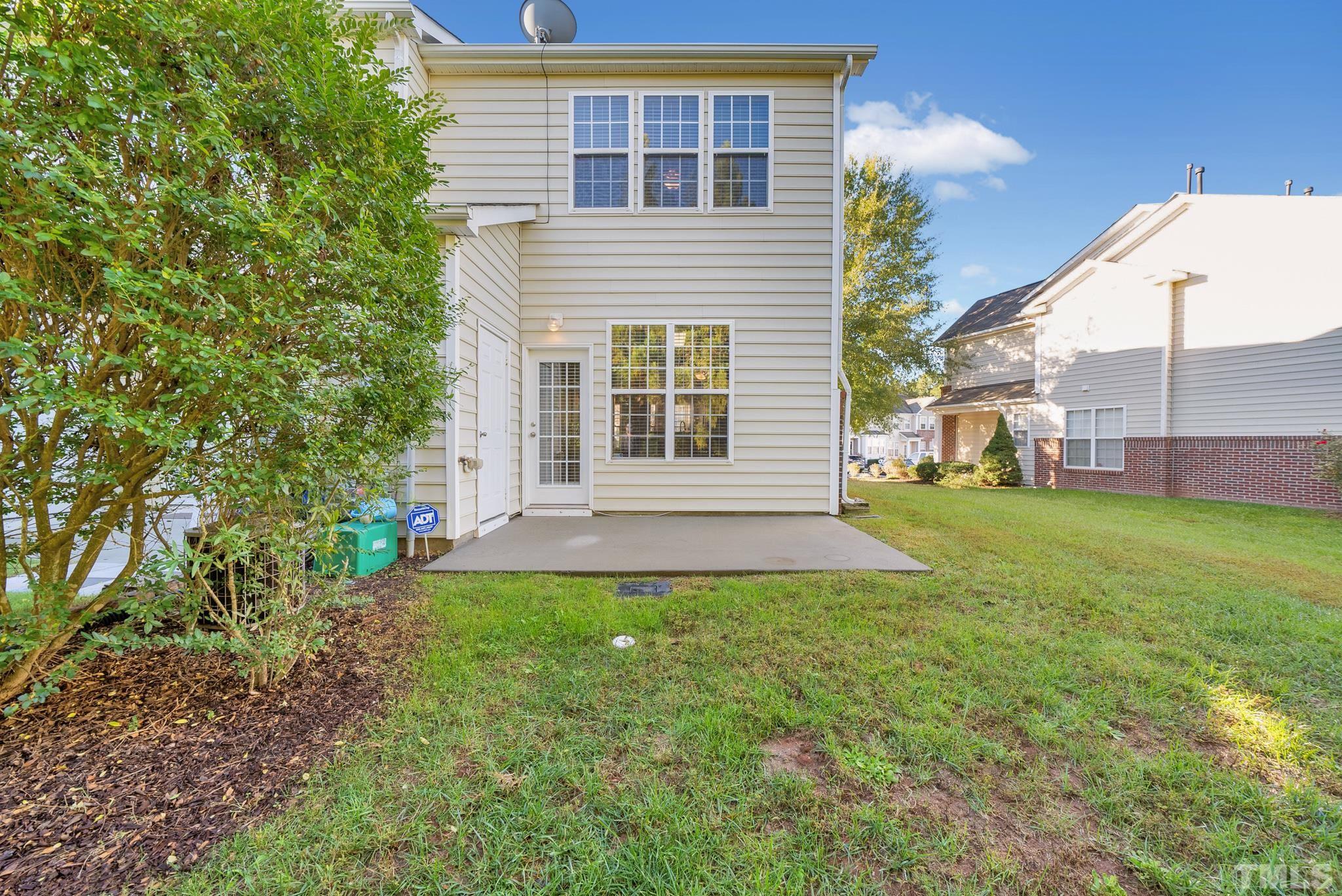 7618 Winners Edge Street Raleigh, NC 27617 - Photo 20 of 22 a view of backyard of house with green space