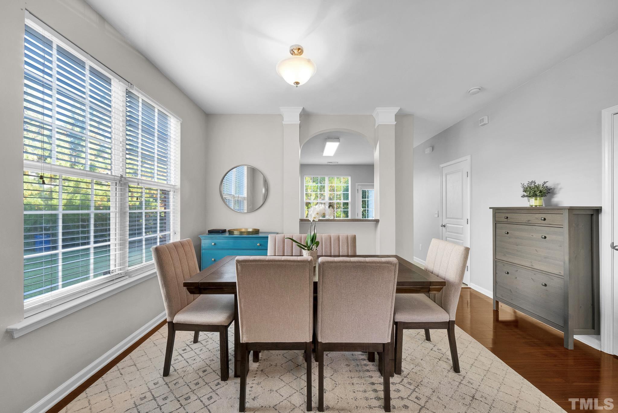 7618 Winners Edge Street Raleigh, NC 27617 - Photo 7 of 22 a dining room with furniture and a window