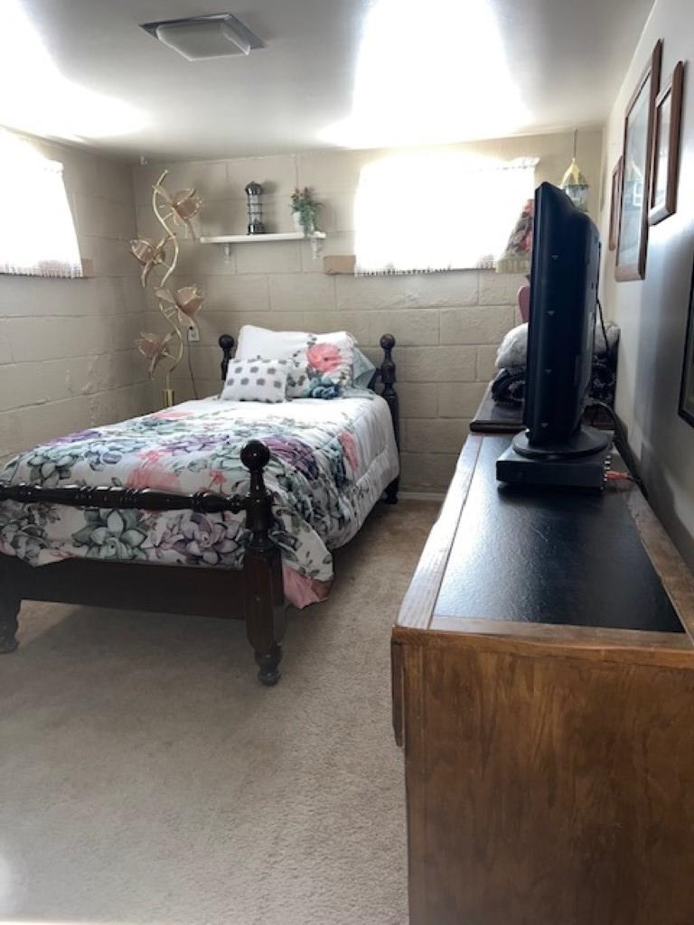 1537 17 Road Loma, CO 81524 - Photo 18 of 41 a bedroom with a bed chair and dresser