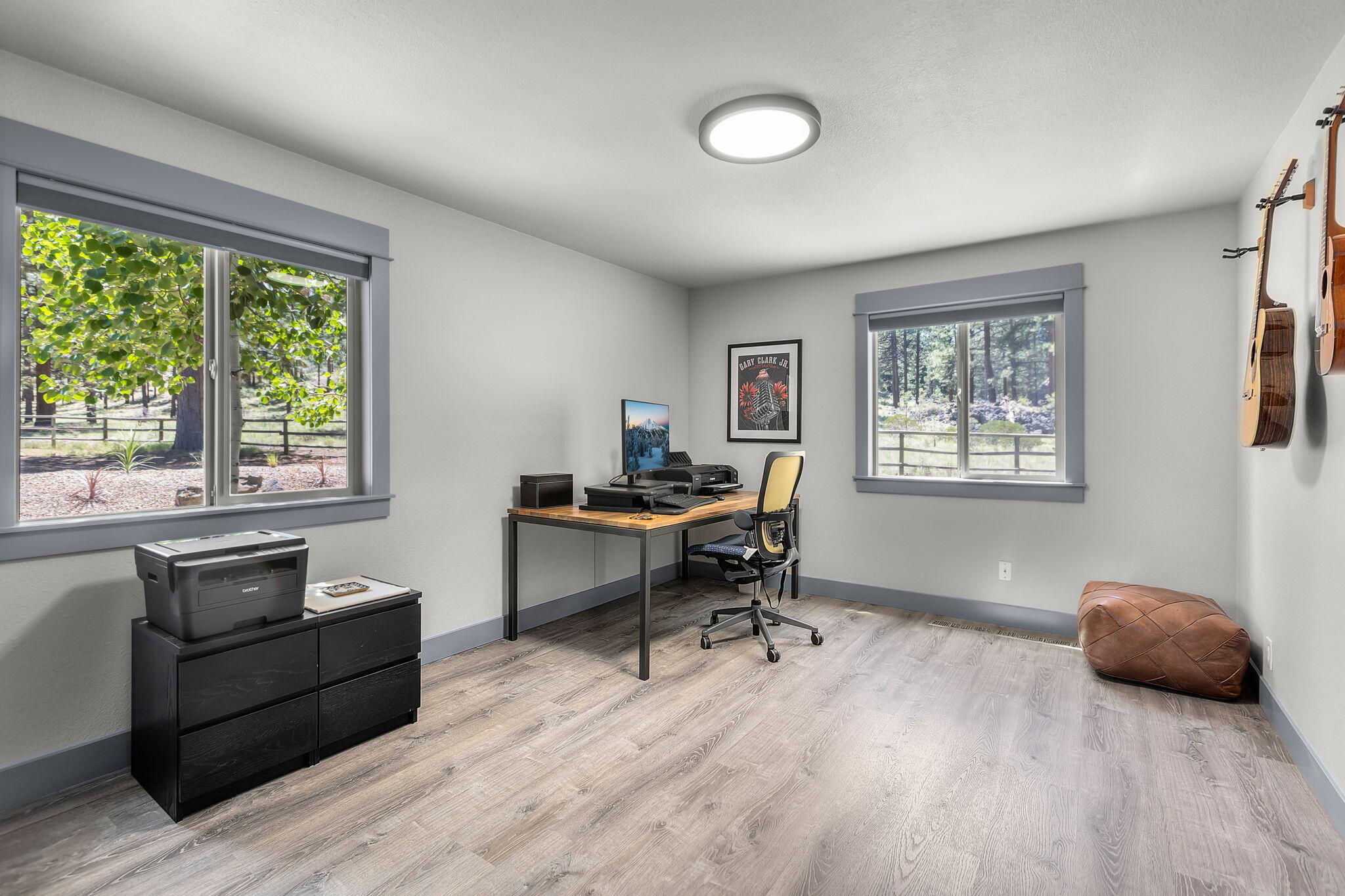 60210 East Ridgeview Drive Bend, OR 97702 - Photo 16 of 55 a view of a workspace with furniture and a window