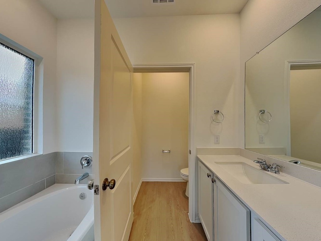 1508 Chapel Ranch Road Georgetown, TX 78628 - Photo 11 of 16 a bathroom with a sink and a bathtub