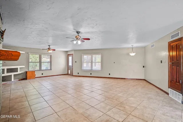 a kitchen with stainless steel appliances granite countertop a stove and cabinets
