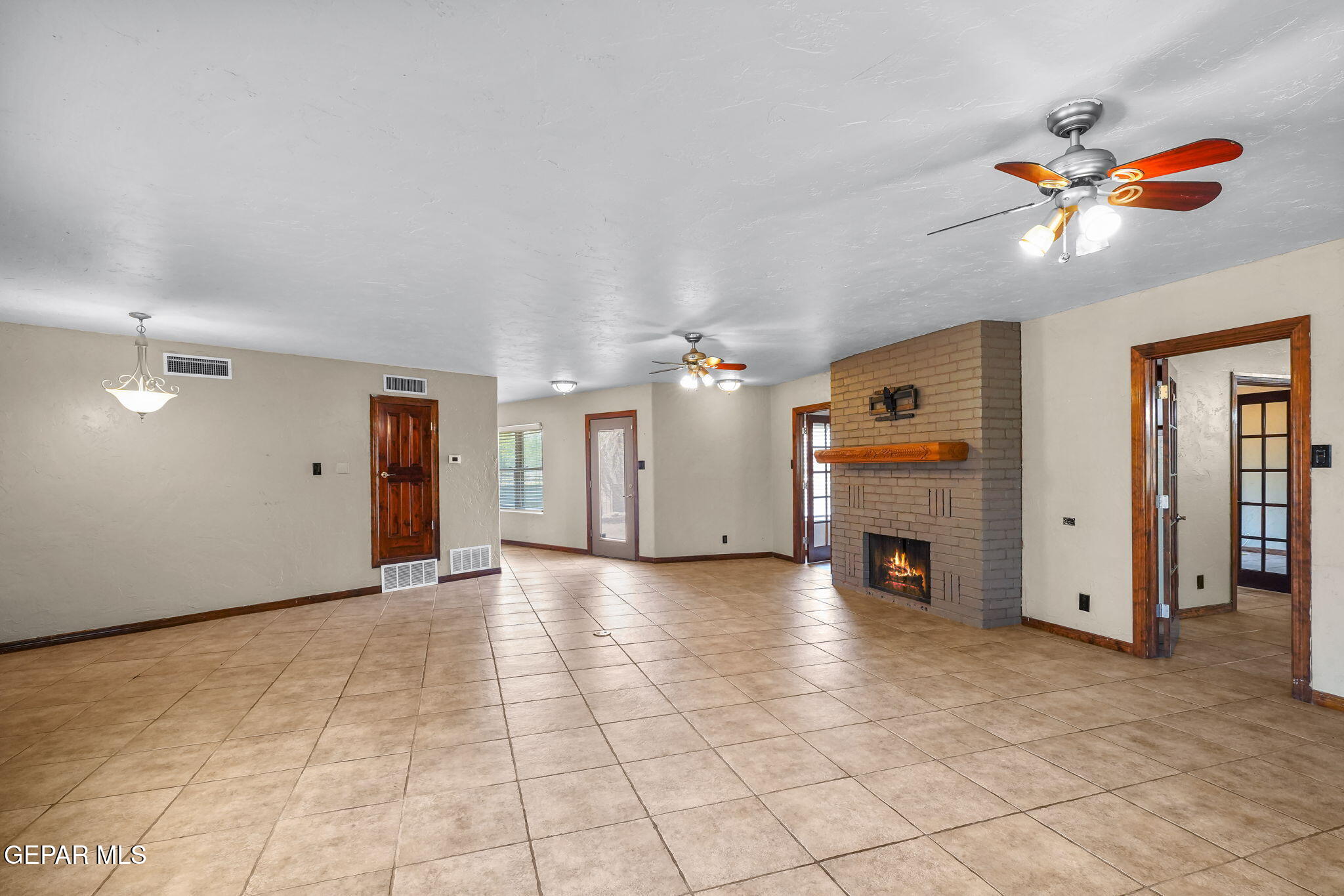 5300 Crawford Road Santa Teresa, NM 88008 - Photo 27 of 87 a view of a livingroom with a ceiling fan and window